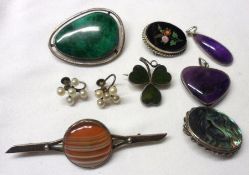 A packet containing five assorted Brooches, a pair of Earrings, Heart Pendant and Oval Pendant