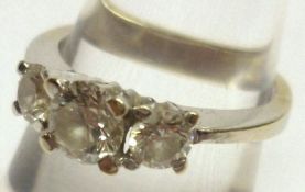 A high grade precious metal three stone Brilliant Cut Diamond Ring, approximately.7 ct total,