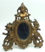 A European Gilded Spelter Table Top Mirror, decorated with putti and bust etc, 8” high