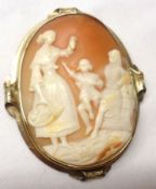 A late 19th Century Gold Framed Shell Cameo Brooch of a family group (unmarked), measuring 62mm x