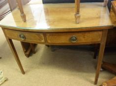 An Edwardian Mahogany Bow Fronted Side Table, crossbanded top with hatched stringing, raised on