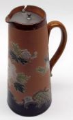 A Royal Doulton Slaters Leather-Glaze Hot Water Jug, decorated with coloured foliage on a pale ochre