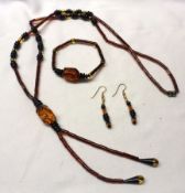 An Amber Tube Tie Necklace with matching Bracelet, weight approximately 28 gm