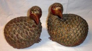 A pair of Oriental carved and painted Treen Models of Game Birds, (one missing claws on feet),