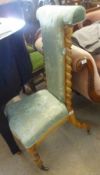 A Victorian Satinwood Prie Dieu Chair, upholstered in coloured and blue/green floral print,
