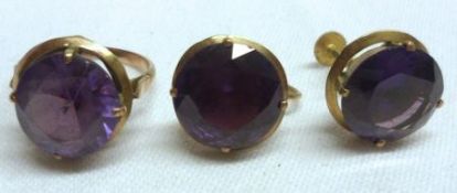An unmarked yellow metal Dress Ring set with a circular Alexandrite; together with a pair of