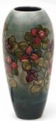 A Moorcroft Large Vase of tapering cylindrical form, decorated with the “Bougainvillaea” design on a