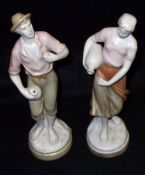 A pair of Royal Dux Figures, comprising a young peasant man and woman, each carrying vessels and