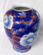 A Modern Oriental Baluster Vase, decorated in underglaze blue with rosettes and foliage on an iron