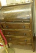 An Edwardian Mahogany Cylinder Front Three Drawer Bureau, fitted with two drawers and pigeonholed