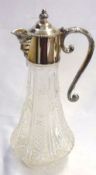 A 20th Century Moulded Glass Claret Jug of circular baluster form, plated mount, 10 ½” tall