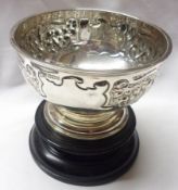 A late Victorian Small Rose Bowl of plain circular form, having embossed panels of flowers and