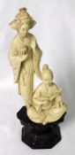 A Composition Group of Geisha and Musician, integral socle, 10 ½” high