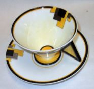 A Shelley Vogue shaped Cup and Saucer, decorated with the “Blocks” pattern, circa 1930