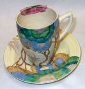 A Clarice Cliff Cup and Saucer, decorated with a Rodanthe design