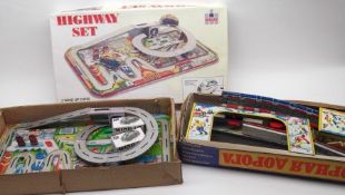 A Welby Tinplate Highway Set, in original box; a further Russian Tinplate Clockwork Set in