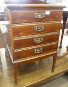 A late Victorian Mahogany Four Drawer Music Cabinet, each drawer with drop down front and brass