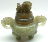 A Green Jade two-handled Covered Koro, the lid decorated with a temple dog finial and the two