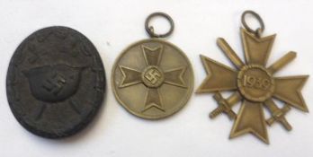 Third Reich 1939 War Merit Cross 2nd Class with Swords; together with Black Wound Badge and German