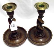 A pair of small early 20th Century Oak Candlesticks with twisted supports, 7” high