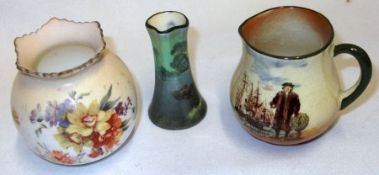 A collection of three Doulton Burslem small Globular Vases, decorated respectively with a head and