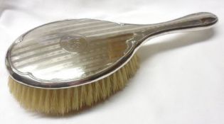 A George V Silver-backed Hairbrush with banded and engine-turned decoration, monogram to a