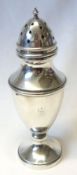 A George V Caster of vase shape to a loaded circular base, beaded detail, urn finial to the
