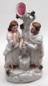 A large Staffordshire Spill Vase, Biblical Group, of a man and woman by a fountain, flesh colour and