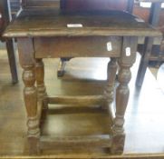 An Oak Coffin Stool, of rectangular form, the top with a moulded edge over a plain frieze and raised