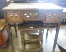 An 18th Century Elm Three Drawer Low Boy, later brass swan neck handles, to tapering legs (much