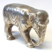 A Miniature white metal Model of an Elephant, naturalistically engraved, 3” long, 1 ½” tall (marks