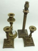 A pair of Brass Candlesticks with baluster foliate moulded knopped stems; a further Corinthian