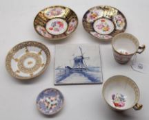 Two 19th Century English Cups and Saucers, each painted in colours with panels of stylised foliage