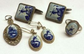 A packet of Dutch Delft panelled white metal Jewellery, including pair of Earrings, pair of