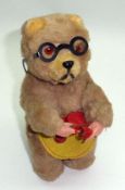 A mid-20th Century plush-covered Clockwork Bear knitting, height 6”