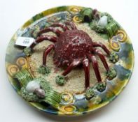 A 20th Century Portuguese Majolica Circular Plate, decorated in the grotesque manner with