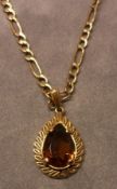 A hallmarked 9ct Gold Orange Quartz teardrop-shaped Pendant with hallmarked 9ct Gold surround and