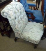 A Victorian Button Back Floral Upholstered Nursing Chair on turned front legs, 30” high