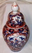 A late 19th Century Japanese Imari Covered Baluster Vase, of ribbed tapering circular form,