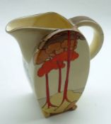 A Clarice Cliff Jug of oval form, decorated with the “Coral Firs” design in colours on a honey glaze