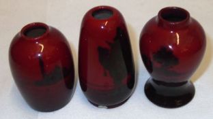 Three small Royal Doulton Flambé Vases, decorated with various typical patterns, all approx 2 ¼”