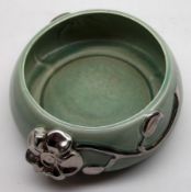 A Clarice Cliff (Newport) circular Bowl, the rim relief moulded with silvered floral sprigs, on a