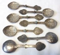An interesting set of seven 19th Century Indian Silver Teaspoons, with elaborately engraved scrolled
