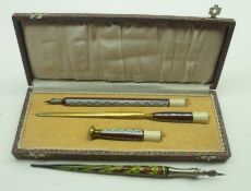 A Vintage Cased Stationery Set, comprising a Dip Pen, Paperknife and Seal (vacant), all applied with
