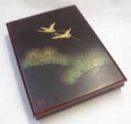 A 20th Century Oriental Lacquered Table Top Box with lift-off lid decorated with cranes and foliage,