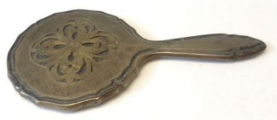 A Miniature white metal mounted Hand Mirror with pierced decoration to back, stamped “800”, 4 ¾”