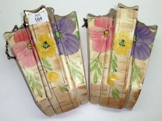 A pair of Arthur Wood Wall Brackets, brightly decorated in colours with stylised foliage with