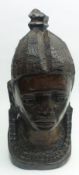 A Carved Hardwood African Tribal Head, 11” high