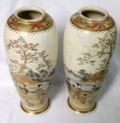 A pair of 20th Century Satsuma Baluster Vases of tapering form, painted in typical colours with