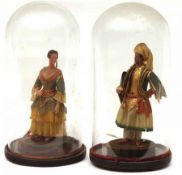 Two Poured Wax Pedlar type Dolls, modelled as a Sheikh with scroll in his right hand, and a Lady